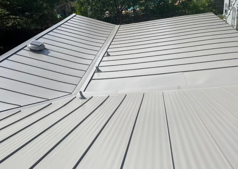 Solar attic fan installed on a metal roof for Roof Ventilation in Palmer Ranch